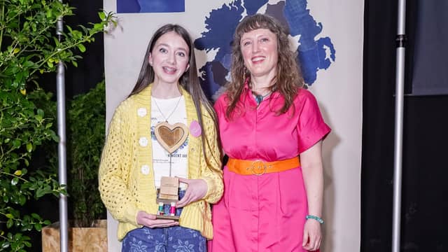 Clonmany’s Cara McLaughlin, pictured with competition judge Arran Murphy, after receiving the national accolade for ‘Best Casual’ design at the Relove Fashion finals at Dublin City University.