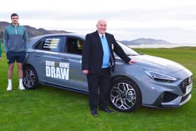 Buncrana Golf Club Captain Liam Henderson, club member and Donegal footballer Caolan McGonagle, and club President Kevin McDermott pictured at the launch of the ‘Drive It Home’ draw.