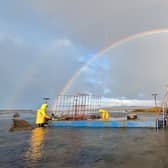 Oyster farmers tend to stock at Oisirí Oileán Cróine Teoranta in Dungloe Bay