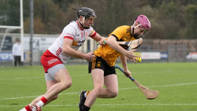 St Eunan's John Kealy gets out in front of Carrickmore's Dean Rafferty in O'Donnell Park. PHOTO: Matthew Harvey