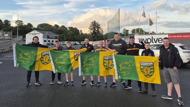 Members of St Eunan's GAA club at O'Donnell Park as they began to undertake hanging Donegal flags around Letterkenny