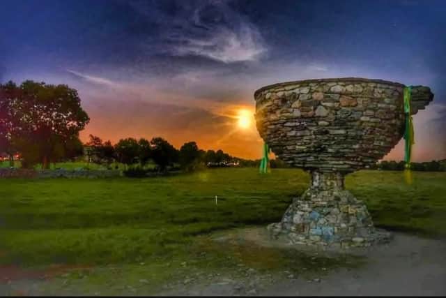 A stone replica of Sam Maguire is available to see in Newtoncunningham, with county colours draped on the sides. Even Patrick the Pilgrim is gone green and gold to support Donegal's quest to win Sam Maguire!