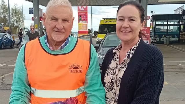 Marie Callaghan, Ballure, Fanad being presented with her prize by Allen McCrea, Friends of LUH