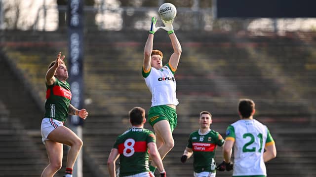 Ciaran Moore goes highest in this midfield battle with Mayo