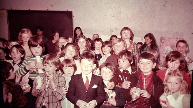 Pupils pictured in September 1975 at the Mass for the official opening of St Aengus National School in Bridgend.