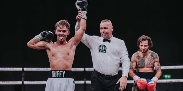 Danny Duffy has his hand raised by referee Emile Teidt. Photos: David Cavan