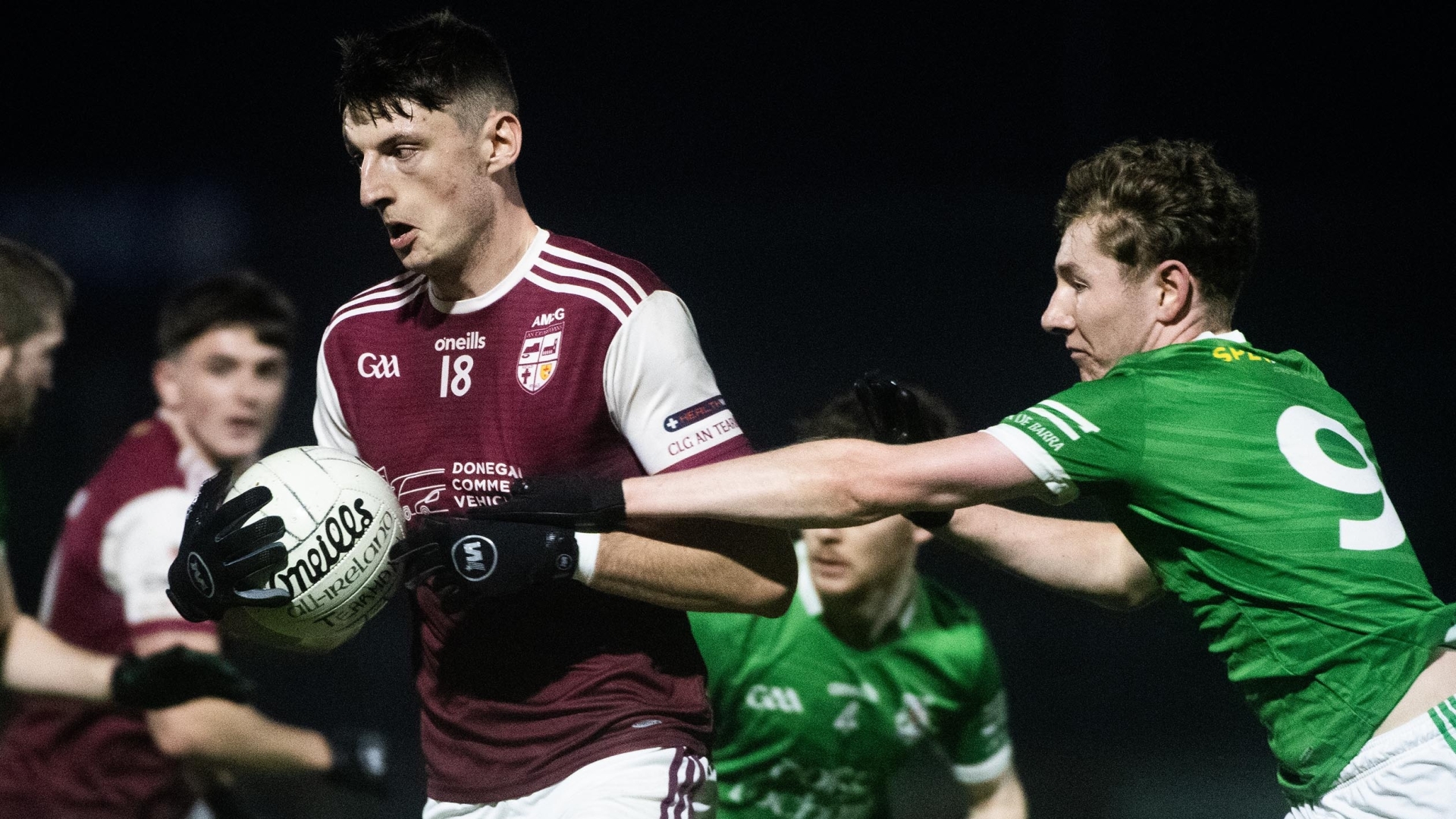 Termon's Bobby McGettigan holds onto possession as Shane Scullion of Derrylauhan Kevin Barry's moves in. Photos: Evan Logan