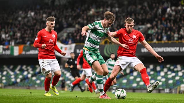 Daniel Cleary of Shamrock Rovers in action against Sean Graham and Sam Todd of Larne