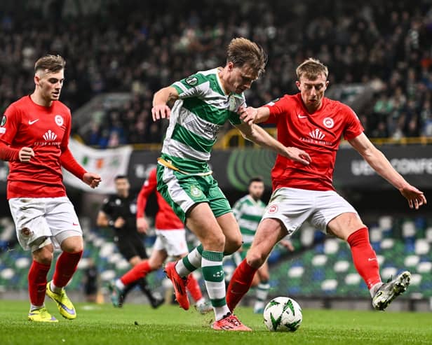Daniel Cleary of Shamrock Rovers in action against Sean Graham and Sam Todd of Larne