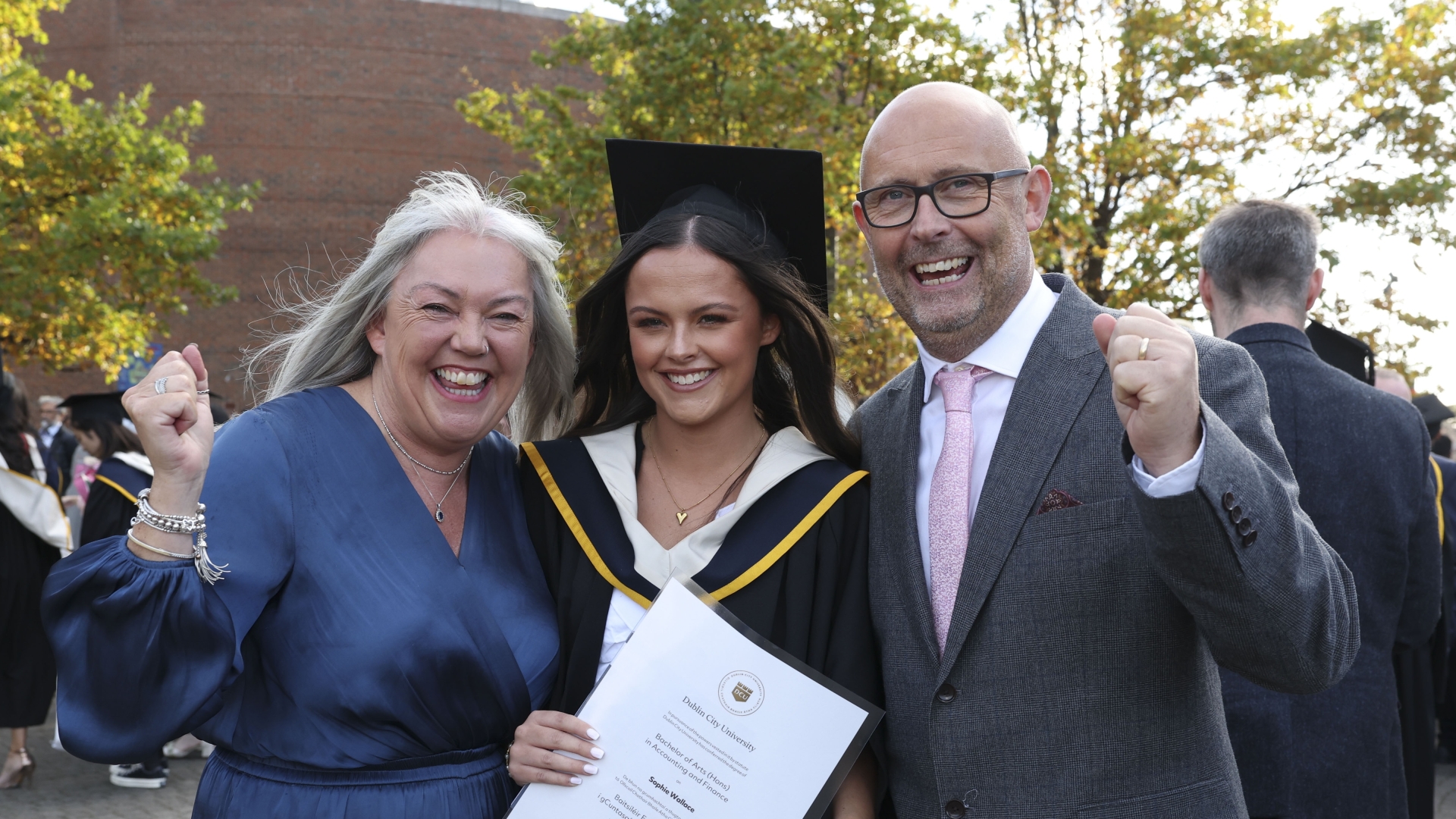 Sophie Wallace from Raphoe with her parents Mark and Elaine with her BA in Accounting and Finance during the October Graduation Ceremony in DCU’S Helix. Photo: Kyran O’Brien/DCU