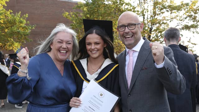 Sophie Wallace from Raphoe with her parents Mark and Elaine with her BA in Accounting and Finance during the October Graduation Ceremony in DCU’S Helix. Photo: Kyran O’Brien/DCU