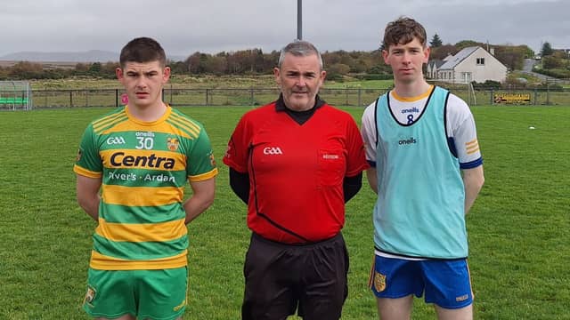 Captains Jamie Elliott and Darragh McIntyre alongside referee Greg McGrory