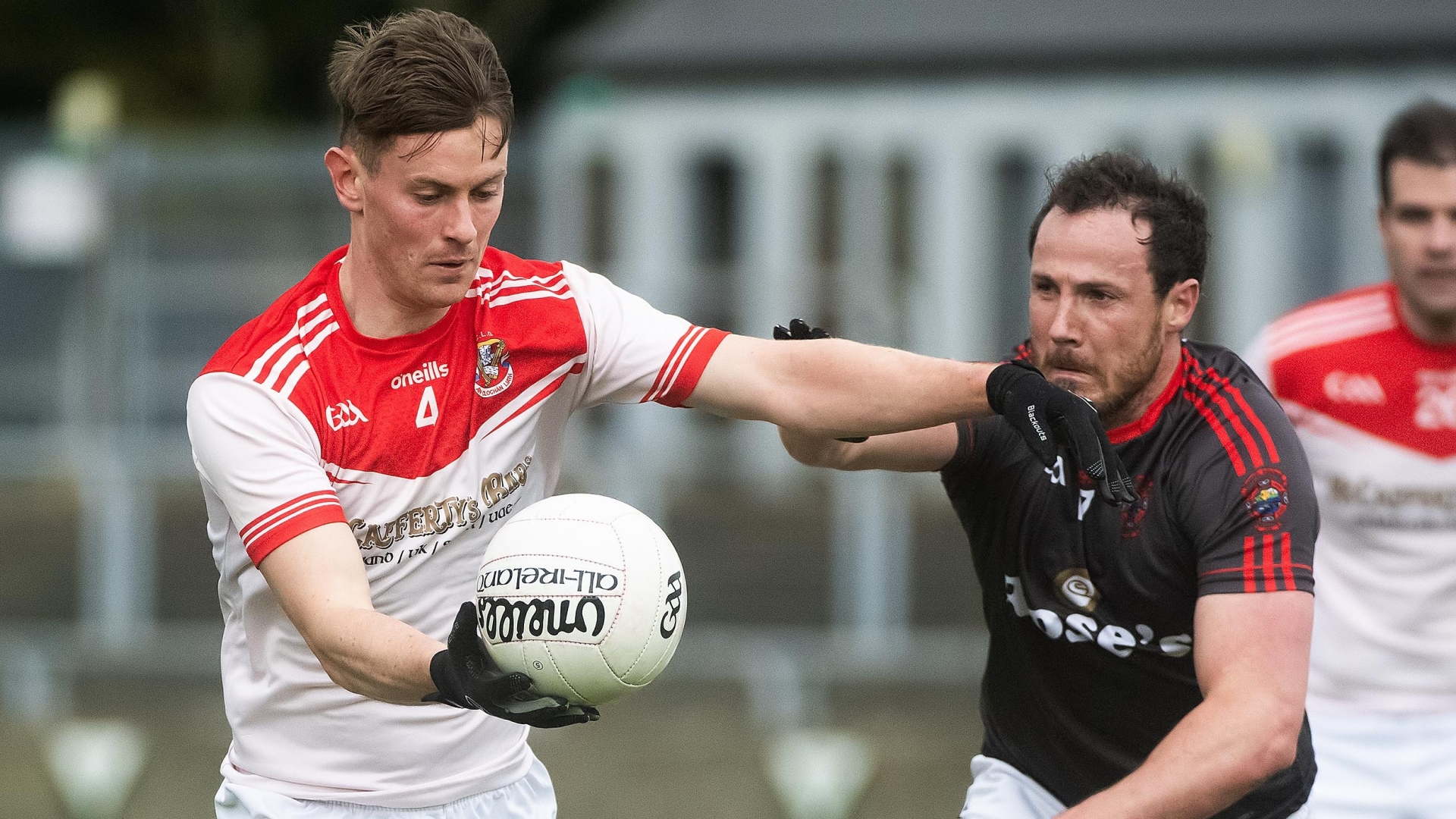 Mark Curran goes past Antoin McFadden