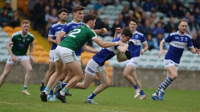 Callum McCrea of Four Masters powers past Adam McGeever of Gaoth Dobhair during their championship quarter-final clash