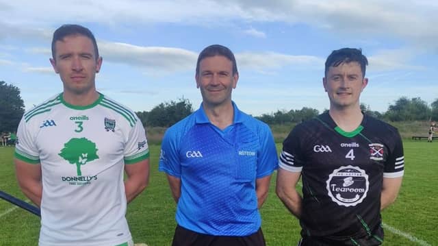 Team captains Kyle Tourish and Mark Callaghan with referee James Connors