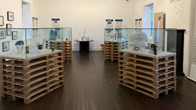 The objects and their labels reveal stories of resistance, peace, anxiety, loss, violence, humour, commemoration and hope