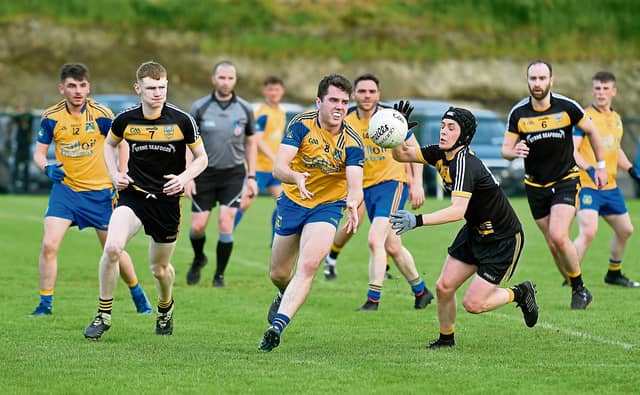 Mark McElhinney's four points played a huge part in Burt's victory over Naomh Bríd