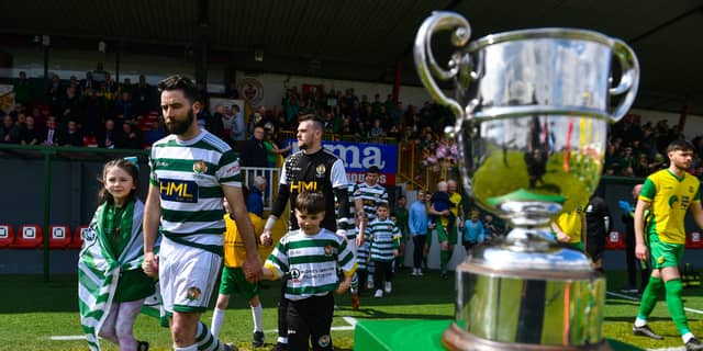 Jimmy Bradley leads Cockhill Celtic out for the Intermediate Cup final in May. Photo: Sportsfile