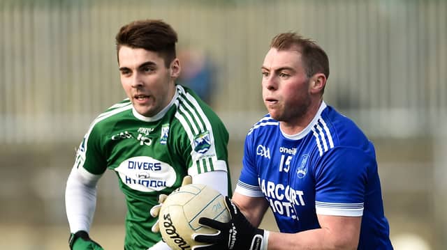 Dermot Molloy of Naomh Conaill in action against Gaoth Dobhair's Michael Carroll in the 2018 Donegal SFC final