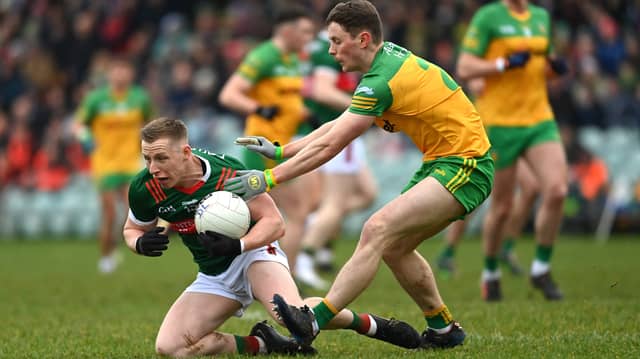 Ryan O'Donoghue of Mayo in action against Mark Curran of Donegal during the Allianz Football League Division 1 match in Ballybofey