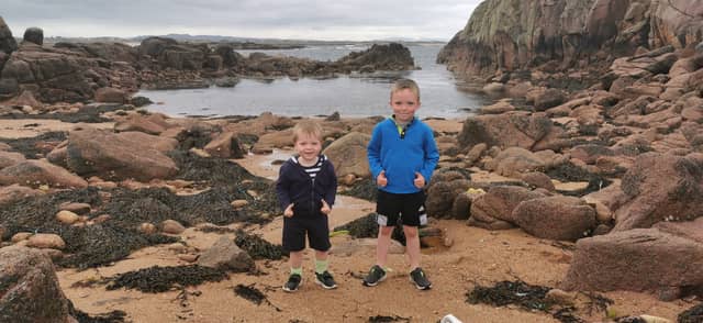 Liam and Joseph McGonagle search the Aughnish area of Cruit Island for ancient fossils
