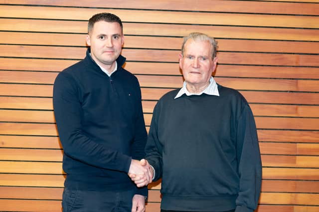 The McGarvey handover! Outgoing councillor Ian McGarvey, right, hands over the reins to his nephew Pauric. Photo: Clive Wasson
