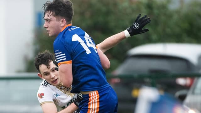 Joel Bradley Walsh of ATU Donegal is tackled by his county colleague Coalan McColgan, who was in action for Ulster University