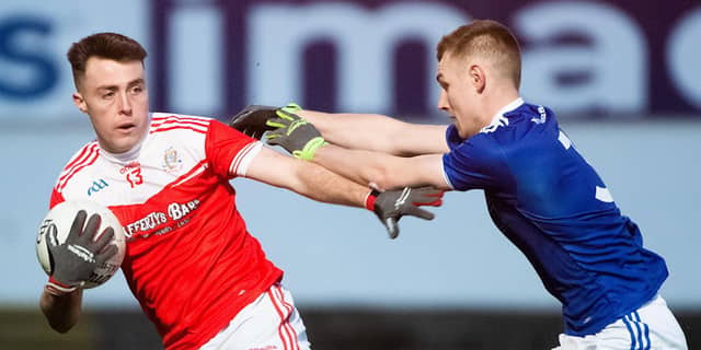 Oisin Bonner of Dungloe on the ball against Conor Quinn of Galbally. PHOTO: EVAN LOGAN