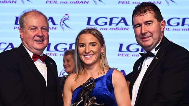 TG4 Senior Players Player of the Year Niamh McLaughlin of Donegal is presented with her award by Ard Stiúrthóir TG4 Alan Esslemont, left, and President of the LGFA Mícheál Naughton