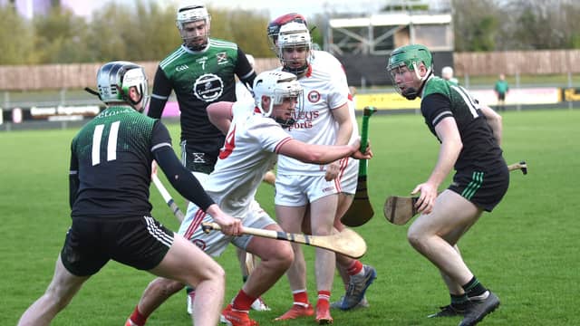 Matthew Mulgrew of Eoghan Ruadh tries to make a break past Setanta's Josh Cronnolly McGee and Oisin Marley. PHOTOS: GERALDINE DIVER