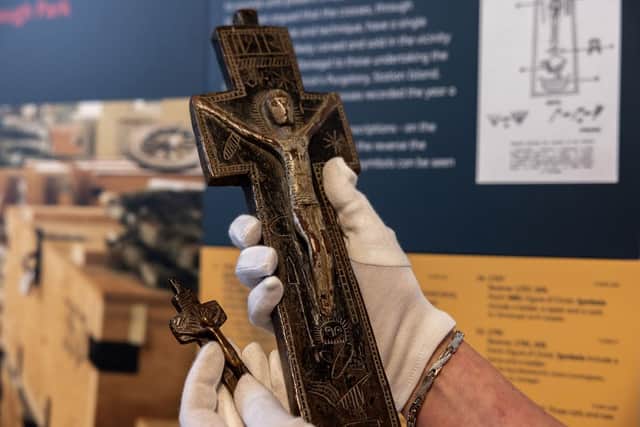 "For autumn, we are displaying 21 penal crosses because this time of year was very much a time for pilgrimage, patterns (communal visits to holy sites), and prayer in folk tradition in Ireland.