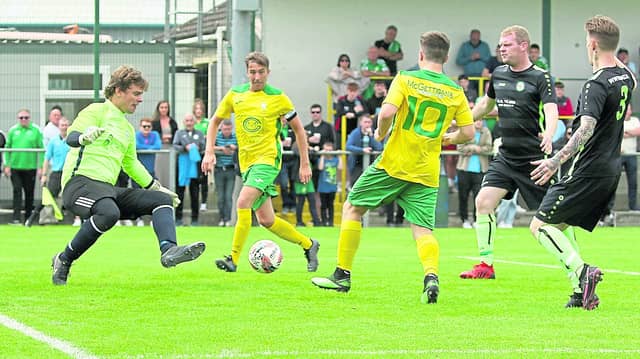 Bonagee United's Tony McNamee puts the ball past Pike Rovers goalkeeper Sean Moroney in the FAI Cup first round clash at Dry Arch Park last month
