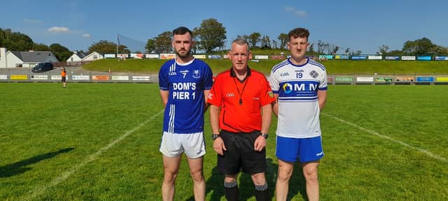 Referee Michael McShane with captains Daire Quinn and Mark Harley