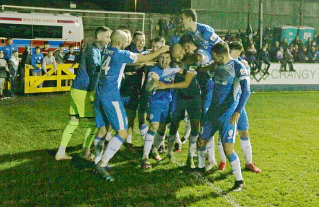 Finn Harps players celebrate with Luke Rudden following his first goal for the club. Photo Thomas Gallagher