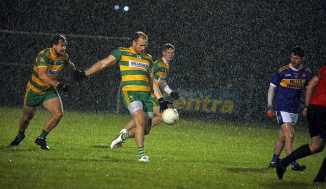 CJ Molloy on the ball for Ardara in the rain in Pearse Park Picture: Thomas Gallagher