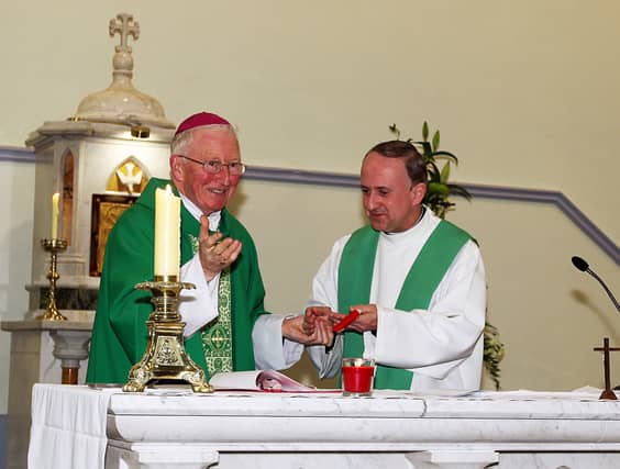 Flashback: Fr. Joe O'Donnell, right, being handed the keys to St Brigid's Church, at his indunction cermony by Bishop of Raphoe, Philip Boyce on in July 2016 Picture Thomas Gallagher
