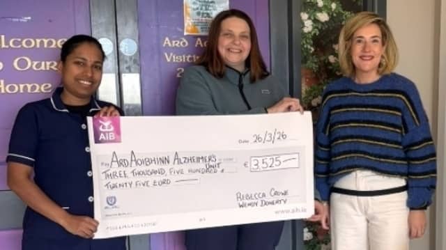 Rebecca Crowe and Wendy Doherty donating €3,525 to the Ard Aoibhinn Unit in Carndonagh. The sum was gratefully accepted on behalf of the dementia-specific Unit by staff member Jishna Prajeesh.