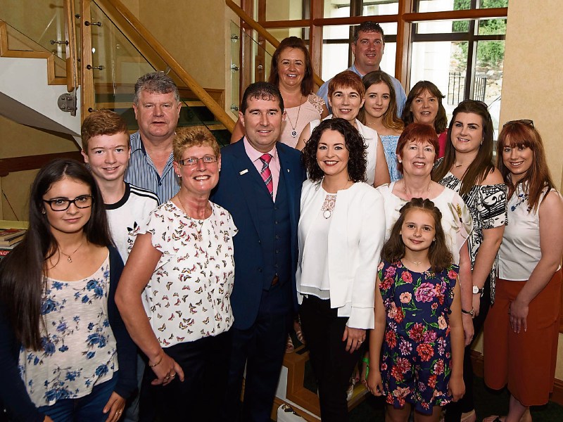 Cllr Micheál Naughton with his family at his first Donegal County Council meeting after filling the seat held previously by the late Sean McEniff. Photo: Clive Wasson