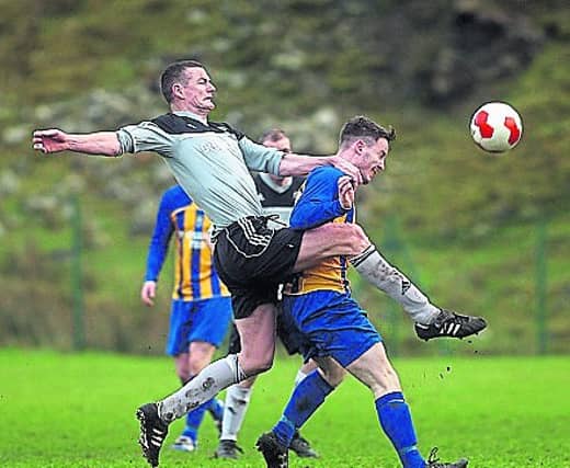 Kevin Rafferty in action for Glencar Celtic against Fintown Harps.