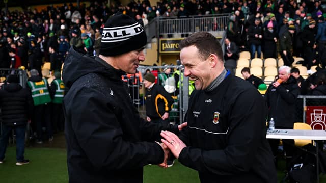Donegal boss Jim McGuinness greets Andy Moran prior to throw-in