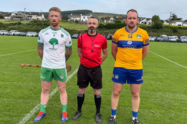 Sean MacCumhaills captain PJ Browne with Burt captain Stephen Gillespie and referee Trevor Maloney