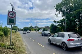 Road safety signage, like here close to St Mura's NS at Burnfoot, advises motorists to reduce speed when approaching schools. 
