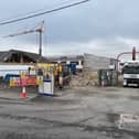 The demolition of the old Scoil Íosagáin school building is under way. The first phase of the new premises, which can be seen in the background, is complete and ready for its first intake of pupils in September. 