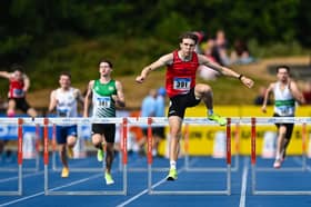 Fintan Dewhirst of Tír Chonaill A.C. on his way to winning the men's 400m hurdles final during day two of the National Senior Track & Field Championships 2026 at Morton Stadium in Dublin.