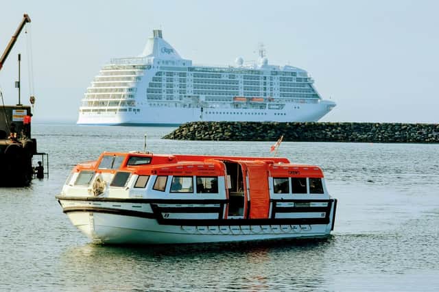 A tender ferrying passengers from the Seven Seas Voyager ashore at Greencastle Harbour.