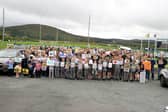 Locals, schools and community groups gathered at the speeding protest