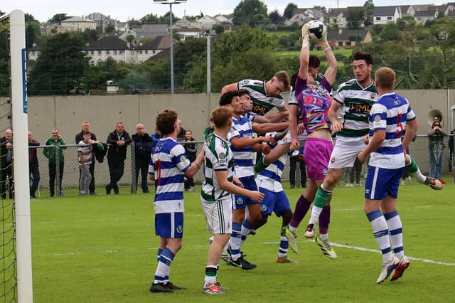 Home Farm keeper Daithi Folan takes the catch from a Cockhill corner kick in the National League on Saturday. Photo: Herbie Barr