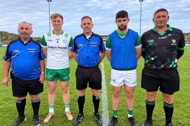 Captains Ian Campbell and Daniel Devlin with match officials