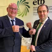 Outgoing Donegal ETB Chairperson Cllr Terry Crossan hands over the chain of office to newly elected Chairperson Cllr Fionán Bradley 