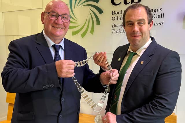 Outgoing Donegal ETB Chairperson Cllr Terry Crossan hands over the chain of office to newly elected Chairperson Cllr Fionán Bradley